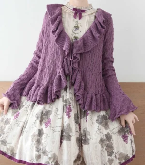 Purple Sunset Bouquet Lolita knit cardigan with cable knit pattern and ruffled trims, front flat lay shot showing openwork design and tie fasteners coordinated with grape print vintage lolita dress and stand collar inner top