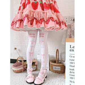Pink and white sweet lolita thigh high stockings with bow and cross pattern, worn with strawberry print lolita dress and pink bow Mary Janes