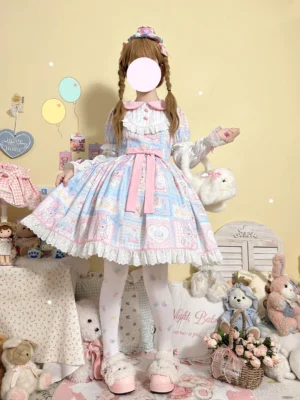 Sweet Bunny Bear Lolita OP dress back three-quarter view featuring pastel pink-blue patchwork bunny and bear print, ruffled Peter Pan collar with heart buttons, lace trimmed skirt hem, and pink waist sash bow