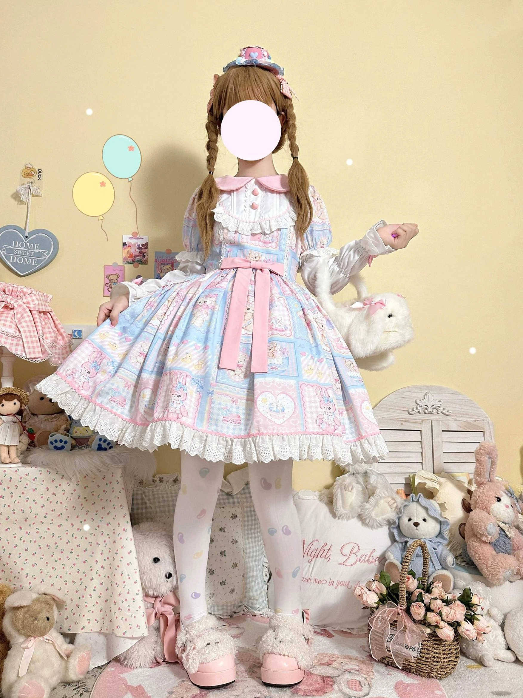 Sweet Bunny Bear Lolita OP dress back three-quarter view featuring pastel pink-blue patchwork bunny and bear print, ruffled Peter Pan collar with heart buttons, lace trimmed skirt hem, and pink waist sash bow