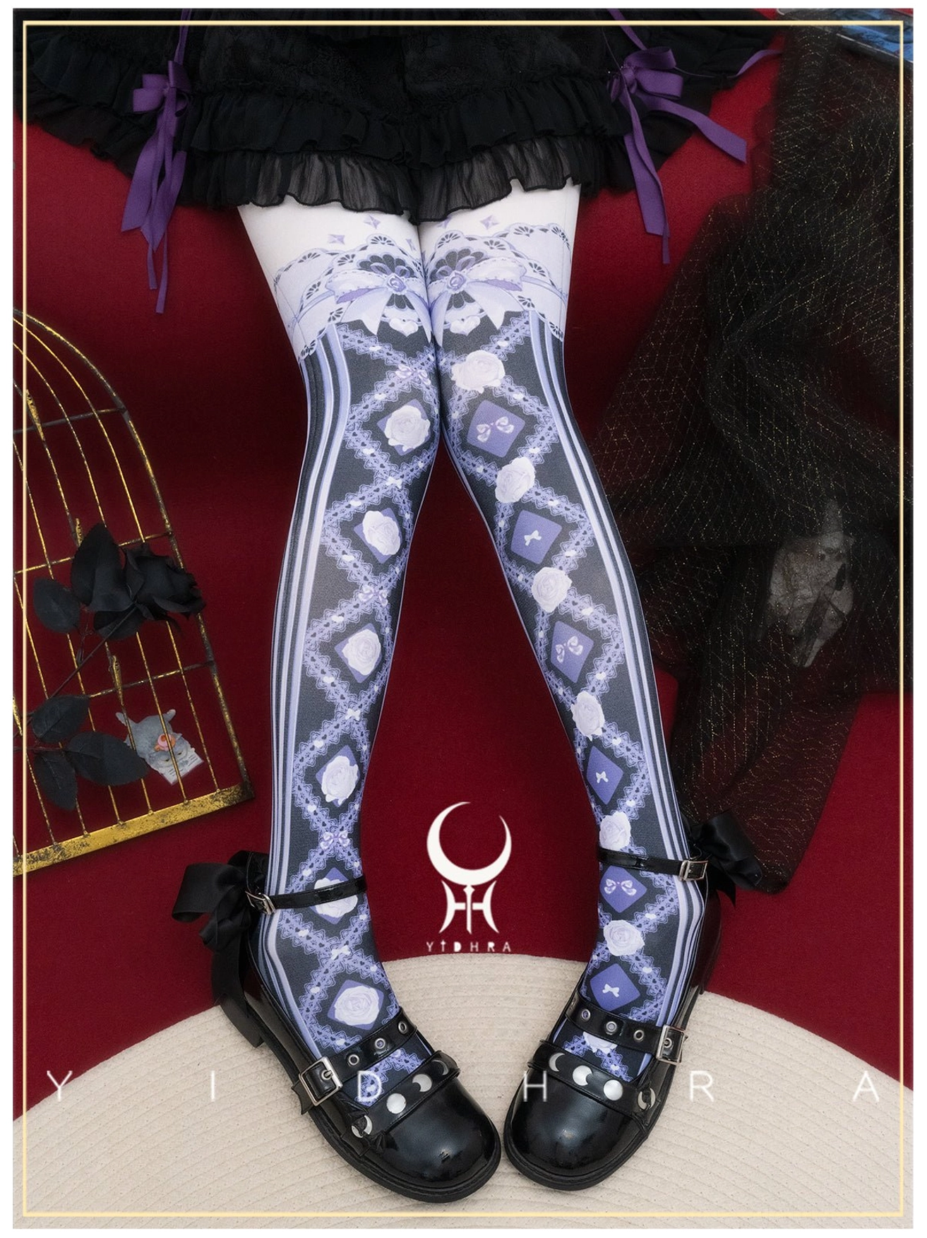 Black-purple gothic lolita over-the-knee stockings with navy floral prints and striped details paired with black ruffled skirt and leather Mary Jane shoes