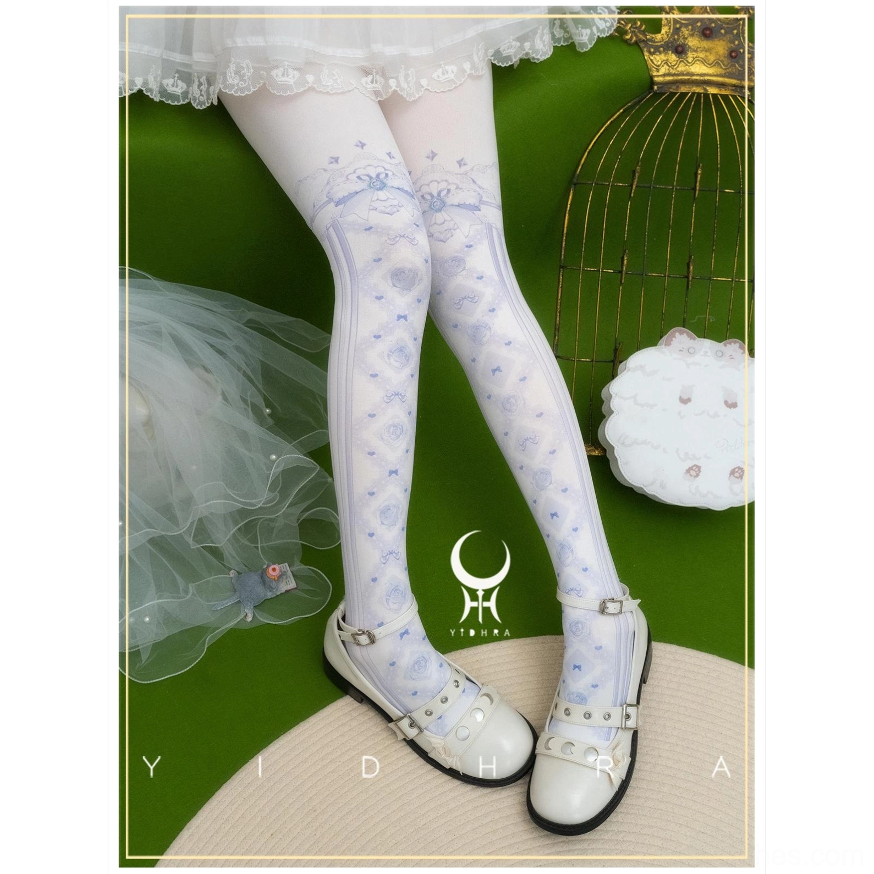 Pale blue rose and bow print lolita pantyhose with vertical stripe details on legs paired with white lace skirt and buckle strap flats