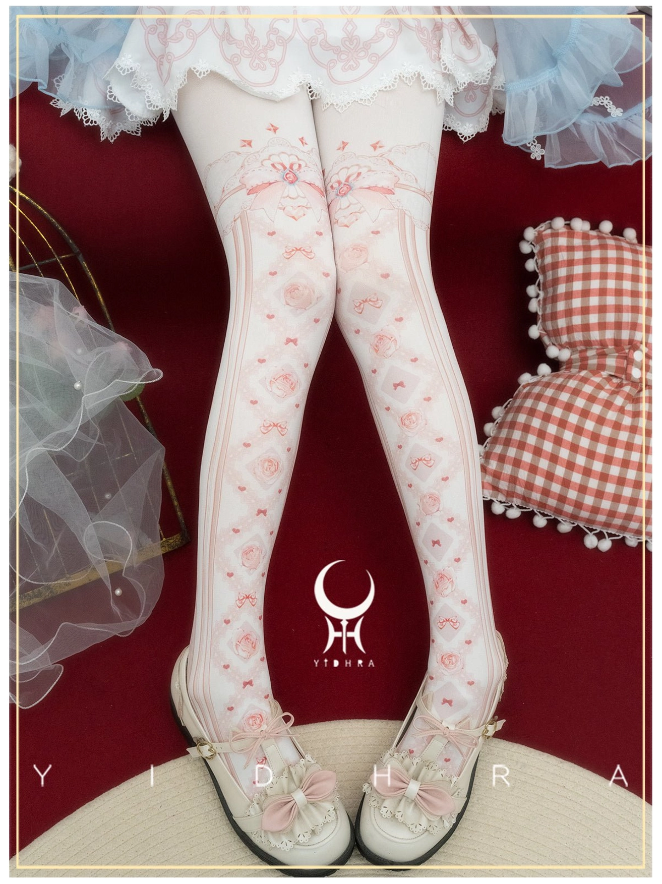 Red lolita floral print pantyhose with delicate rose and bow patterns and ribbon accents at thigh showcase premium dacron construction and fit