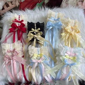 Collection of eight sweet lolita hairband and choker accessories in multiple colors displayed flat on fluffy cushion