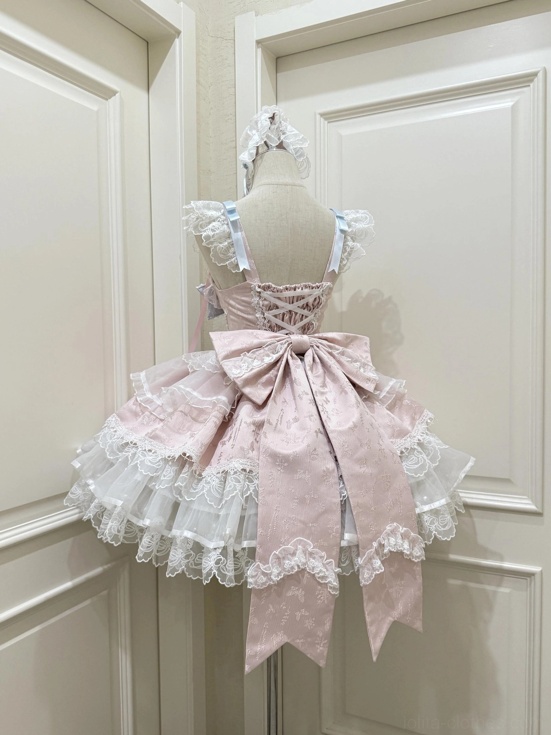 Sweet lolita ballet-style jumper dress JSK back view pink light blue color scheme large pink bow lace bodice