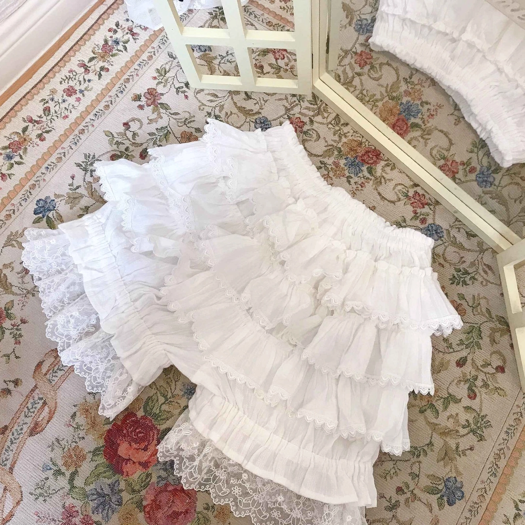 Sweet lolita bloomers anti-exposure feature demonstration showing layering under flowing A-line skirts and bell-shaped lolita dresses for modest fashion aesthetic
