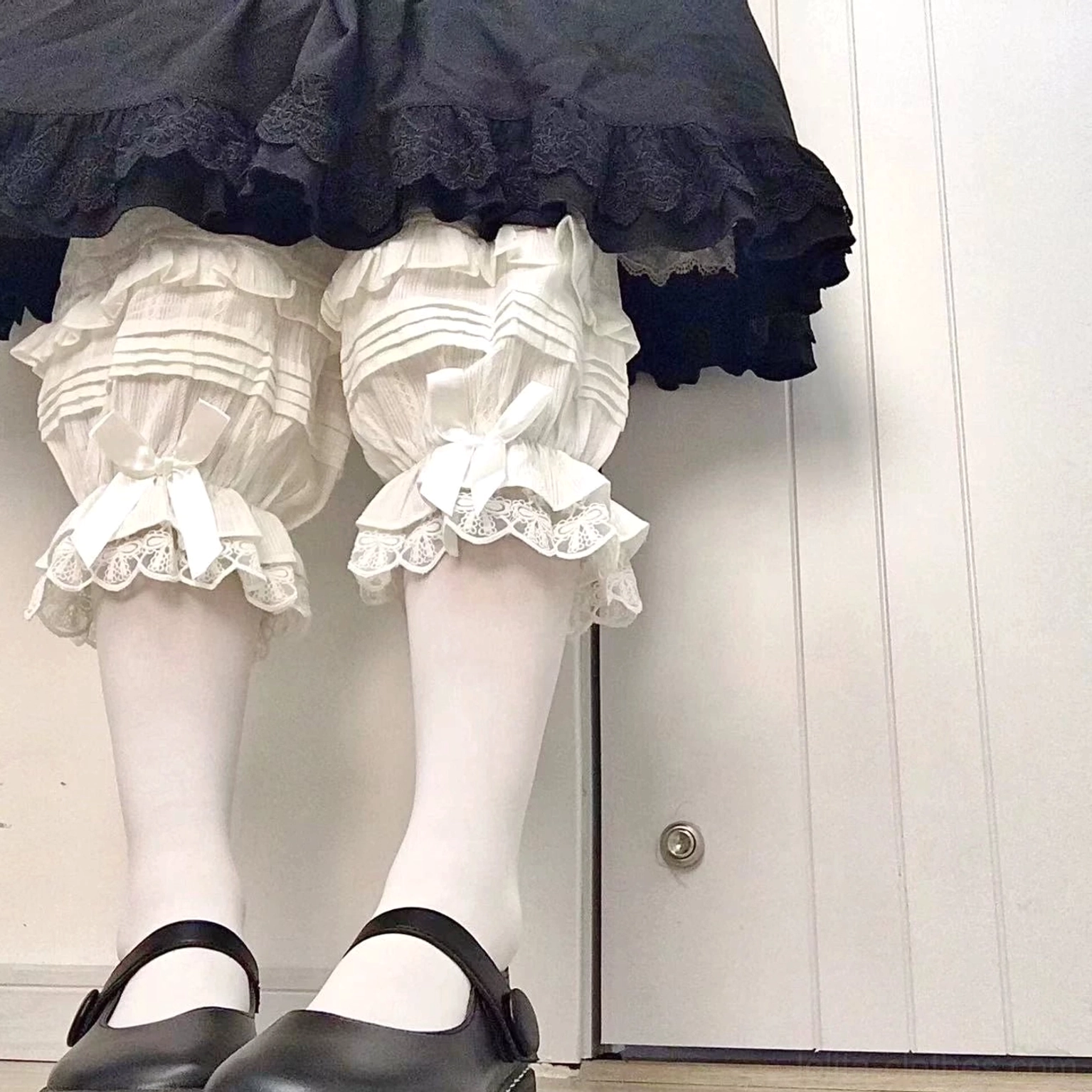 Sweet lolita bloomers detail shot showcasing jacquard cotton fabric texture accordion pleats lace edging and quality craftsmanship material excellence