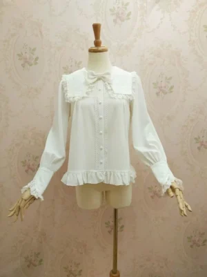 White sweet lolita blouse with oversized sailor collar and lace trim displayed on wooden mannequin front view showing pearl button placket and ruffled hem