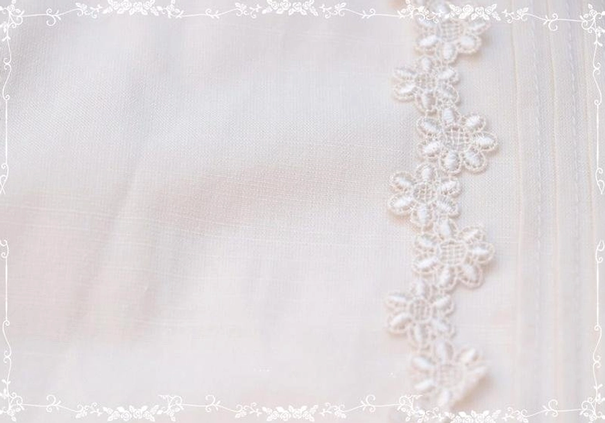 Studio close-up of Peter Pan collar Lolita blouse showing plain woven cotton base and scalloped floral lace trim with neat stitching