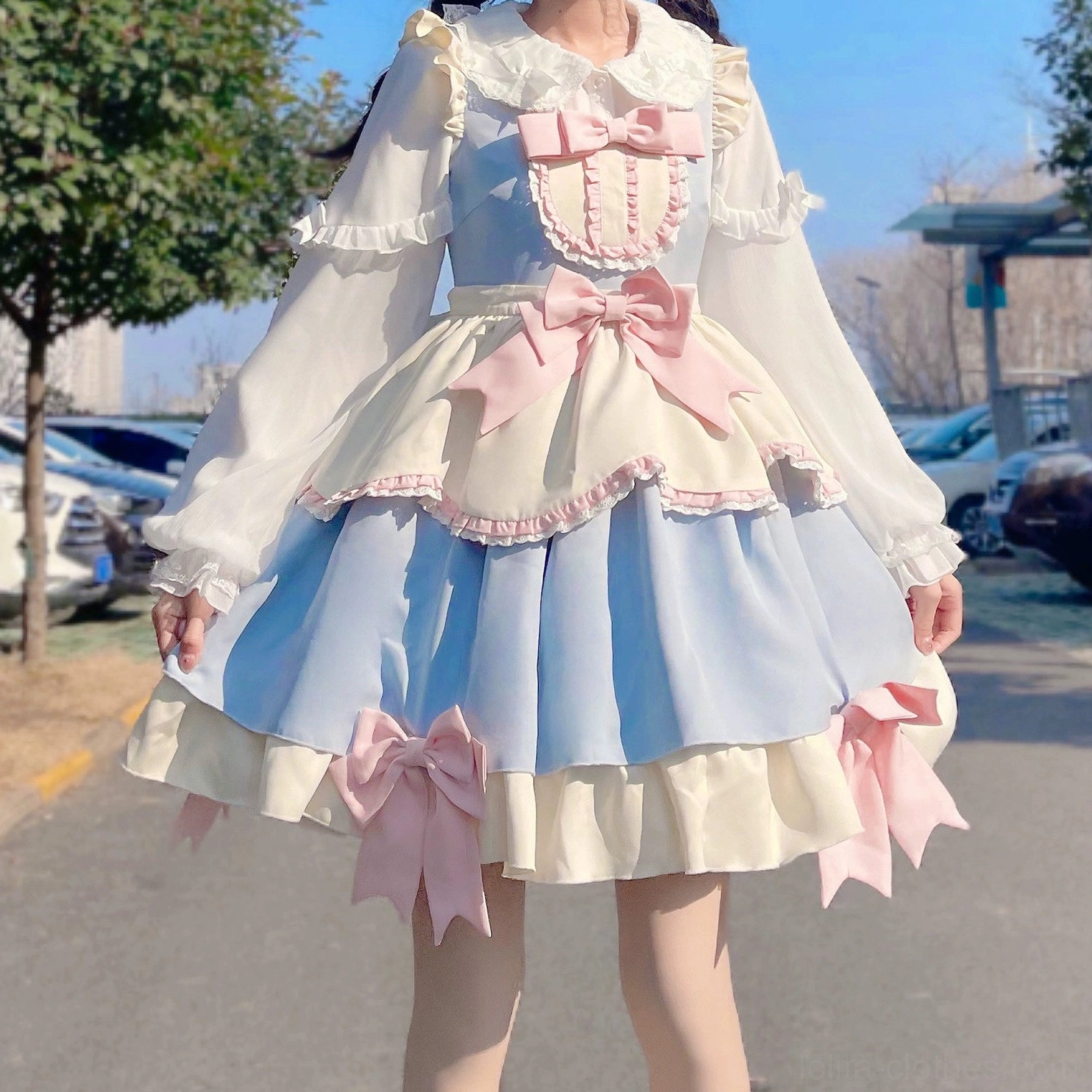 Sweet Lolita blouse sleeve construction detail showcasing puff sleeve design, decorative bow placement and sleeve cuff ruffled trim
