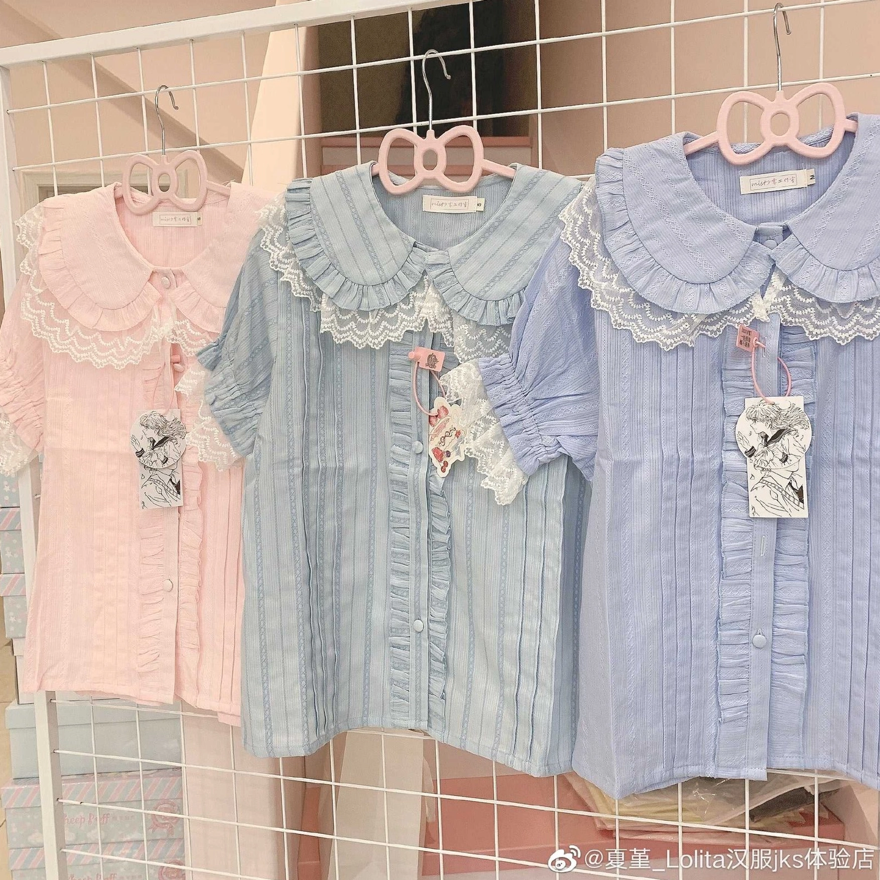 Pastel tone lolita short sleeve blouses peter pan collar ruffled lace puff sleeves hanging clothing rack display