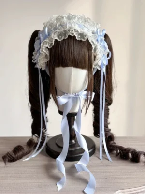 Sweet Lolita pastel blue bow headband with satin ribbons and ruffled lace trim displayed on black wig stand front view