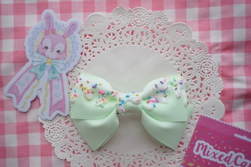 Light green sweet lolita bow hair clip with delicate cream frosting and colorful sprinkles ideal for garden party lolita coords