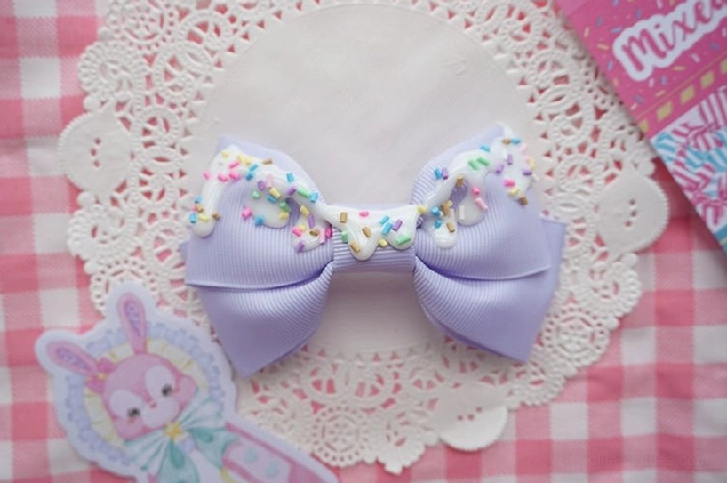 Light purple handmade sweet lolita bow hair clip with cream topping and candy sprinkles for dreamy magical girl themed coordinates
