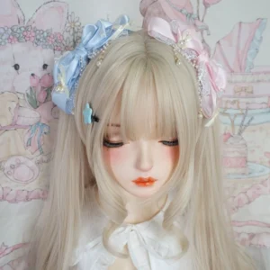 Two sweet Lolita layered bow hair clips in blue and pink displayed together on blonde doll, front view featuring star-shaped hairpins and pearl-adorned lace trim