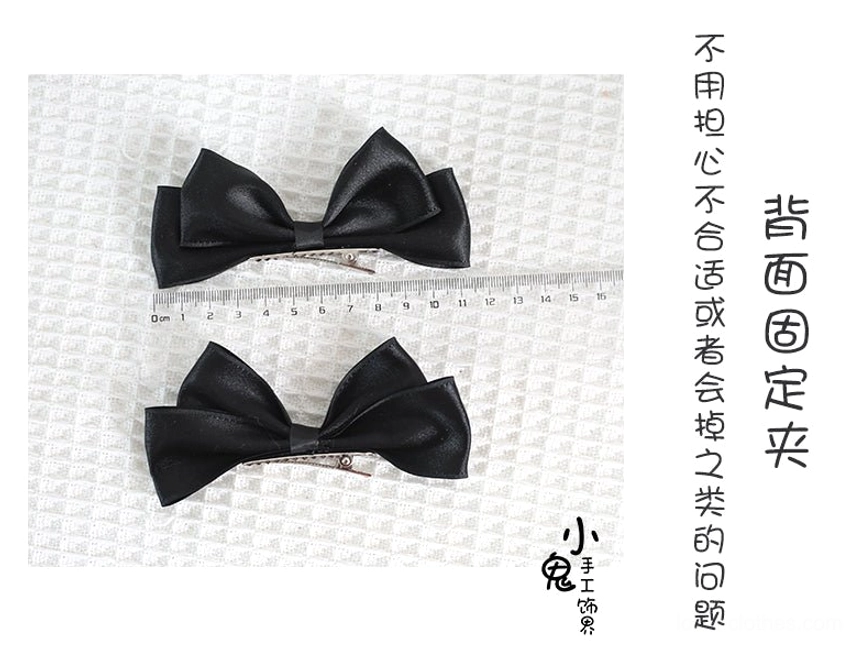 Sweet Lolita satin bow hair clips styled in high ponytail on mannequin demonstrating practical ponytail styling method and secure metal clip grip