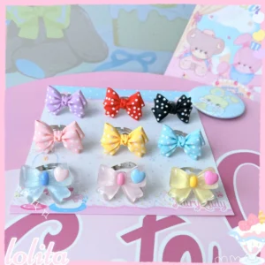 Complete collection of sweet lolita bowknot adjustable rings in multiple pastel and shimmery colors displayed on pink lolita-themed desktop with product card