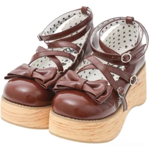 Sweet lolita brown patent leather platform Mary Jane shoes with bow ornament and dual buckle ankle straps displayed from frontal overhead flat view