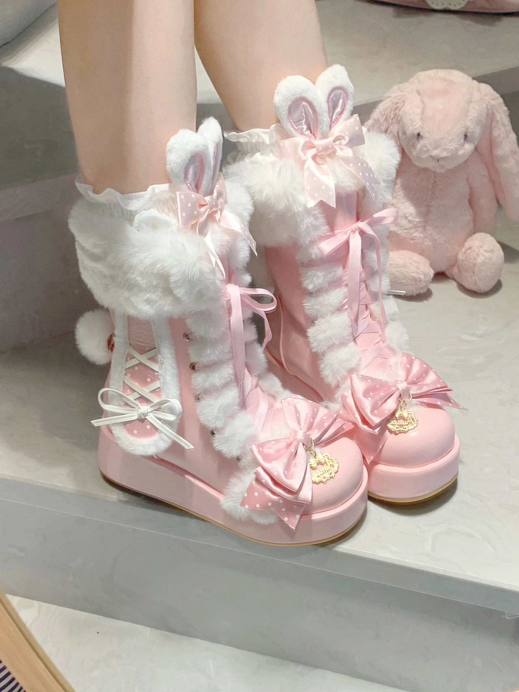 Sweet lolita fluffy bunny ear platform boots detailed product shot showing bunny ear sculptures, plush fur trim, lace-up closure, decorative bows, metallic accents, and platform sole construction