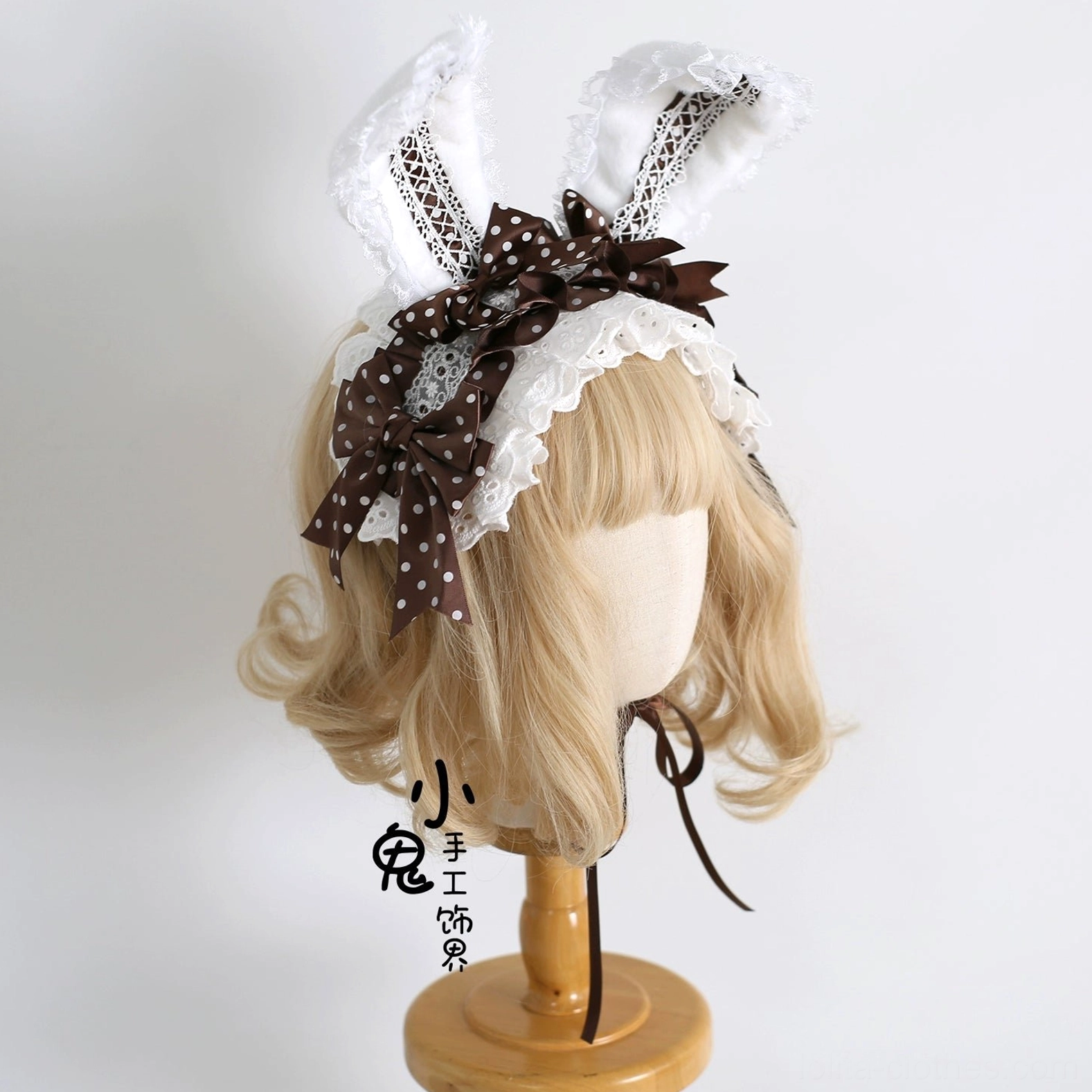 Dark brown coffee polka dot sweet lolita bunny ear hairband with white lace on wooden mannequin head