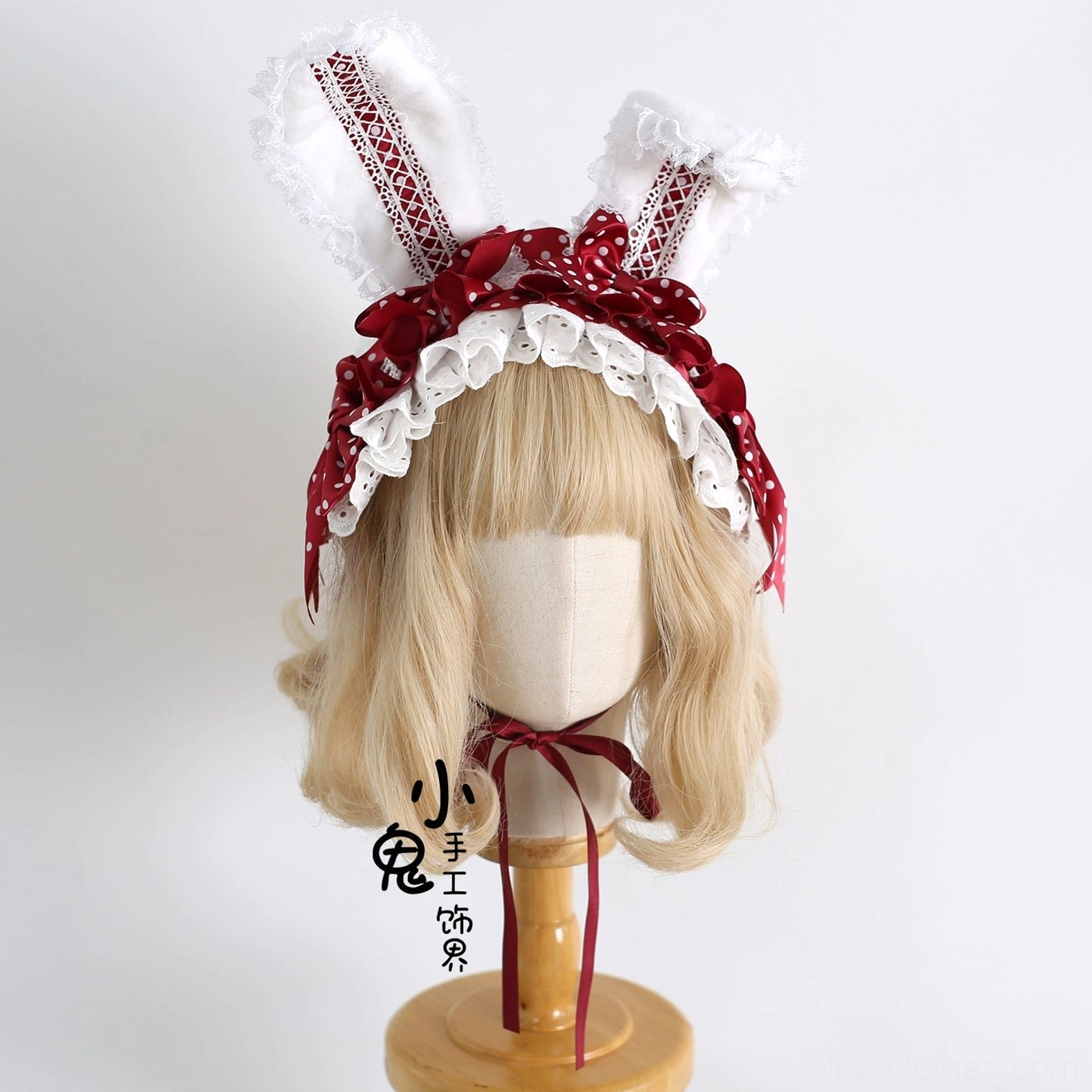 Korean pink sweet lolita bunny ear hairband styled on blonde mannequin with white lace trim and bow