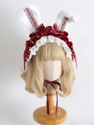 Sweet lolita shapeable bunny ear hairband wine red polka dot bow front view on wooden mannequin with blonde wig
