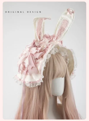 Sweet lolita bunny ear headdress set with detachable pink bow ears on mannequin left front three-quarter view, featuring lace-trimmed pink and off-white design