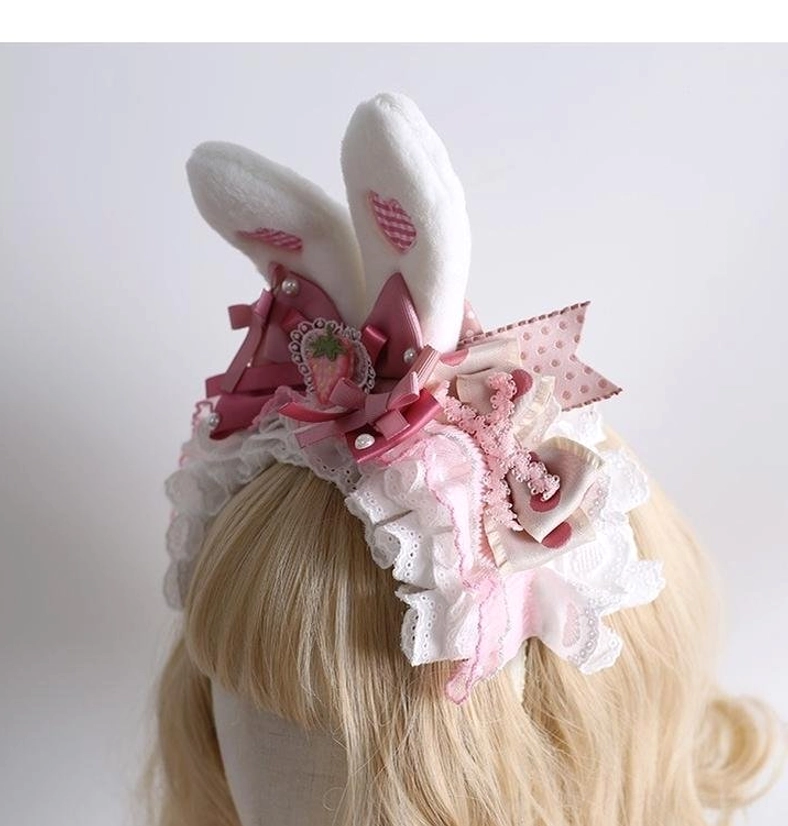 Sweet lolita pink white bunny ear headdress detail close-up showcasing premium lace trim ruffles satin ribbon bows and pearl embellishments for authentic japanese lolita fashion