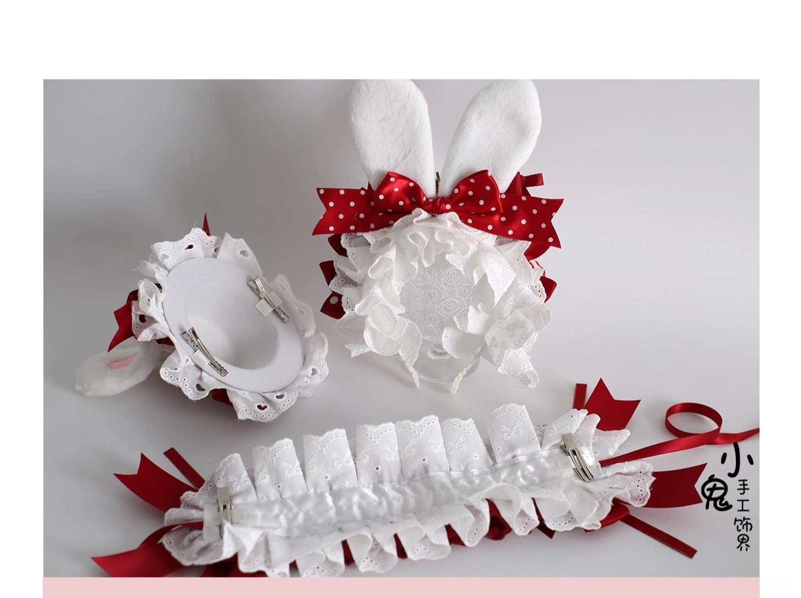 Sweet lolita bunny ear headdress with strawberry charm detail, shapeable white fluffy ears, embroidered red satin bow, and multi-layer ruffled lace construction styling guide