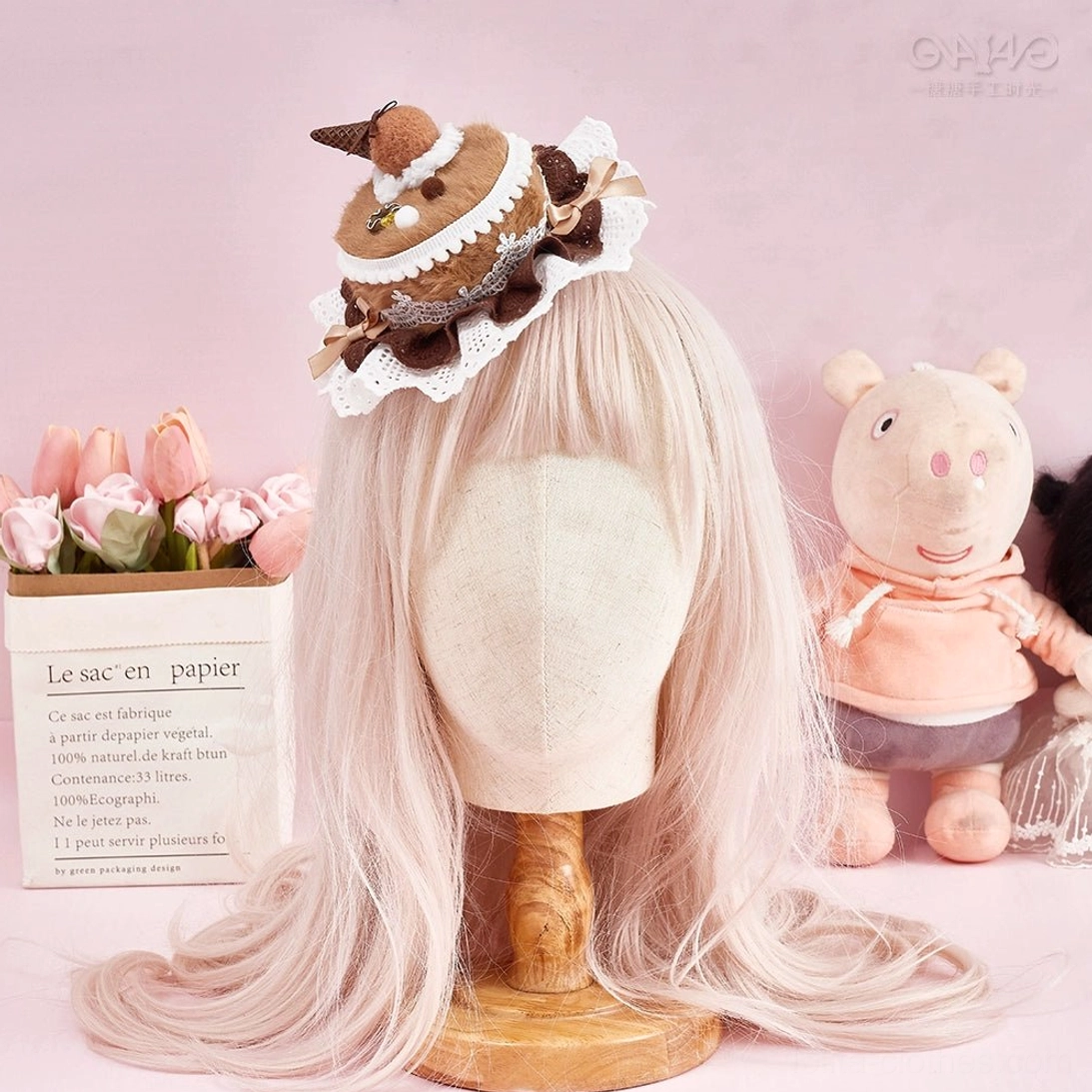 Sweet Lolita cake clip hair accessory detail shot showcasing intricate lace ruffle trim and whimsical dessert charms