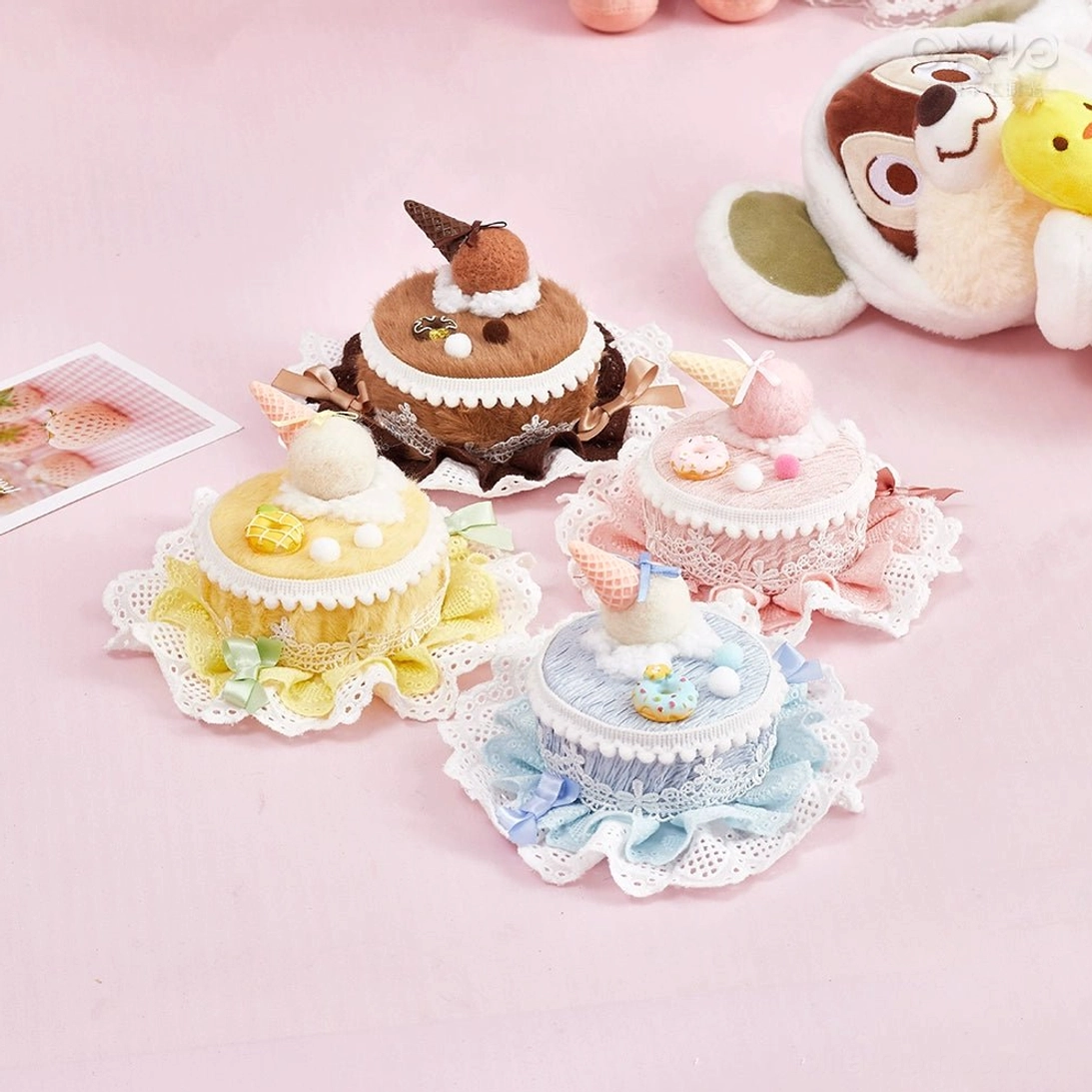 Sweet Lolita cake top clip - all four color variations flat lay display on pink background with lace ruffle trim and miniature dessert charms