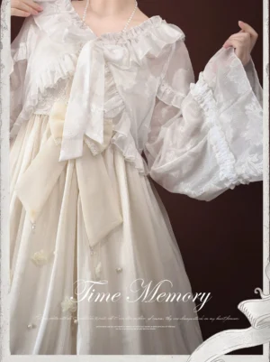 White lolita chiffon lantern sleeve bolero cardigan half-body shot highlighting adjustable tie-ribbon cuffs and ruffled collar worn with beige embroidered JSK