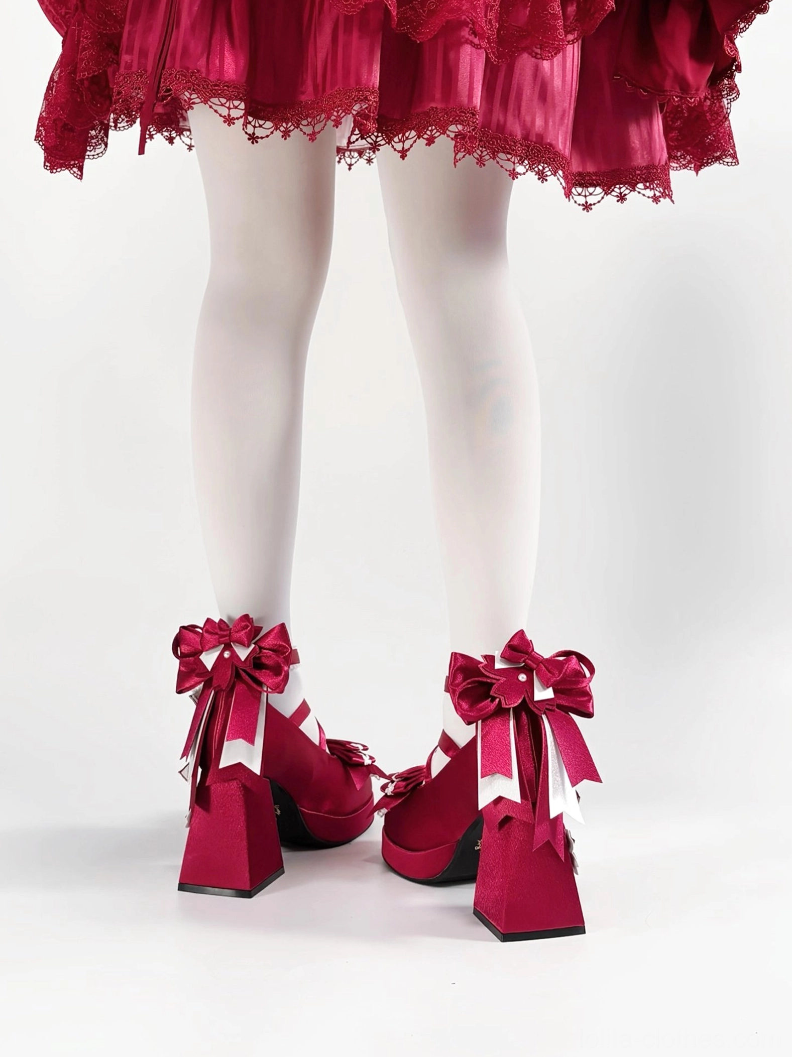 Sweet lolita chunky platform heel shoes close-up detail showing buckle hardware heart shapes and decorative embellishments on ankle straps