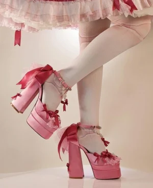 Sweet lolita chunky heel platform shoes styled with pink frilled skirt and nude sheer stockings, back leg view wearing model