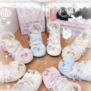 Assorted sweet lolita block heels in pink white and light blue with ruffled edges bow front heart metal charms and round toe chunky heel displayed overhead on wooden table