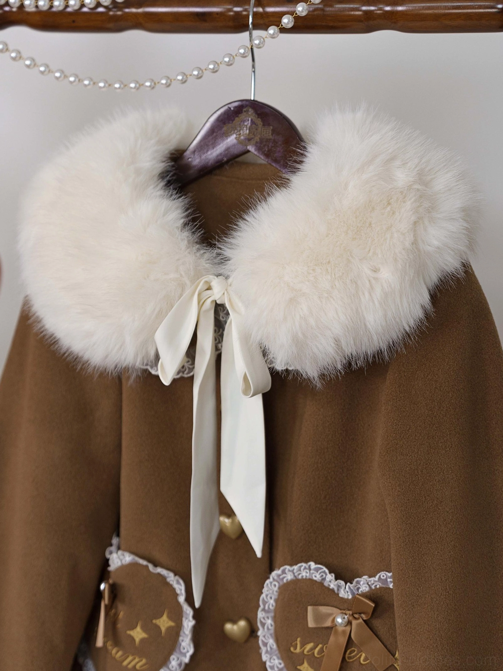 Lolita coat fabric texture close-up showing windproof polyester blend and soft fleece lining material quality and construction