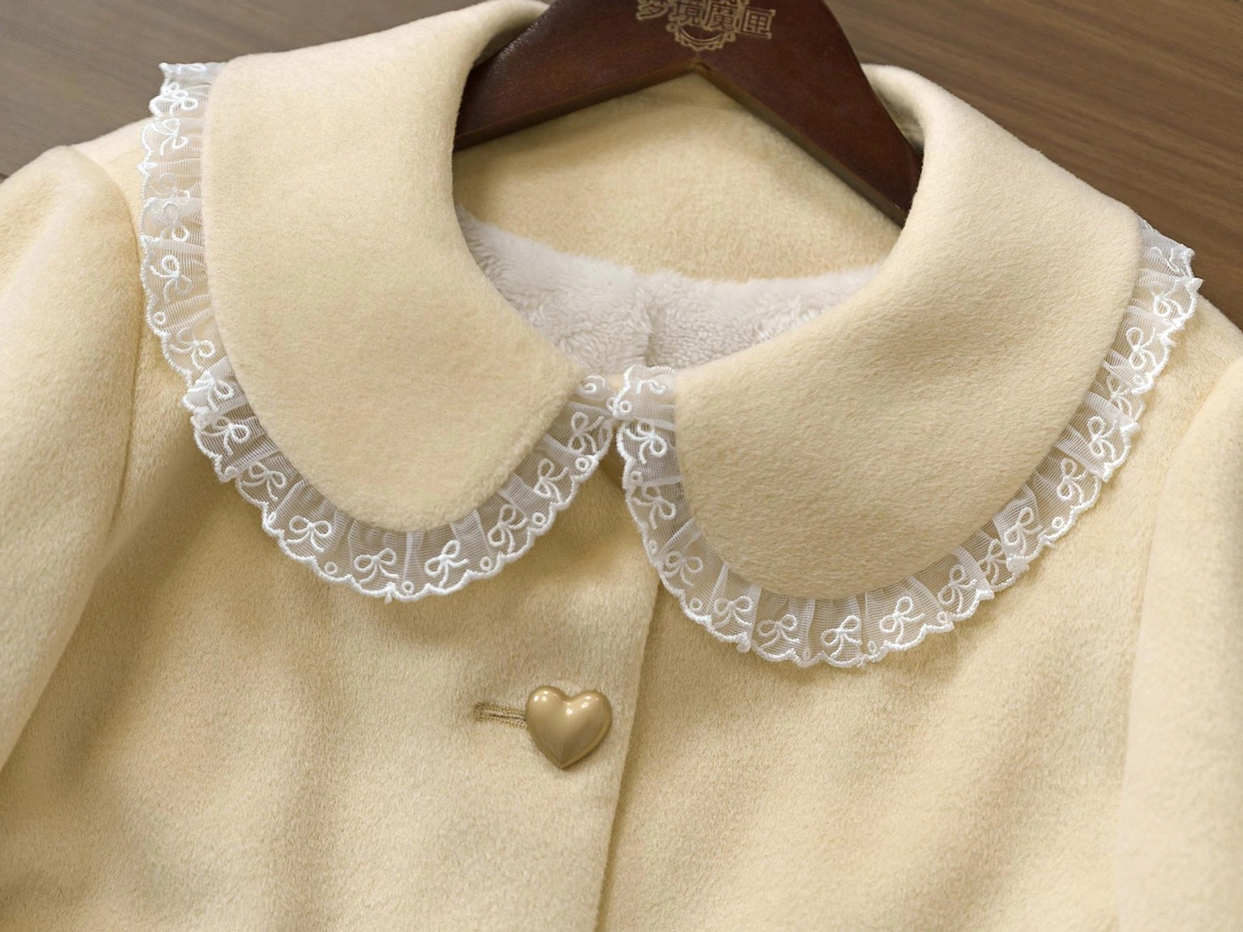 Sweet lolita coat satin ribbon bow neck detail showing elegant accent that reinforces romantic femininity of design