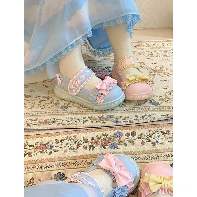 Lifestyle shot of Lolita shoes styled with complete sweet Lolita coordinate including pastel JSK dress, Peter Pan collar blouse and matching hair accessories