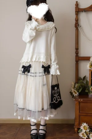 Sweet Lolita white cotton sweater with double-layer ruffled doll collar worn as part of complete daily coordinate set with white knit top and tulle skirt, styled with black Mary Jane shoes and small black handbag in vintage indoor setting