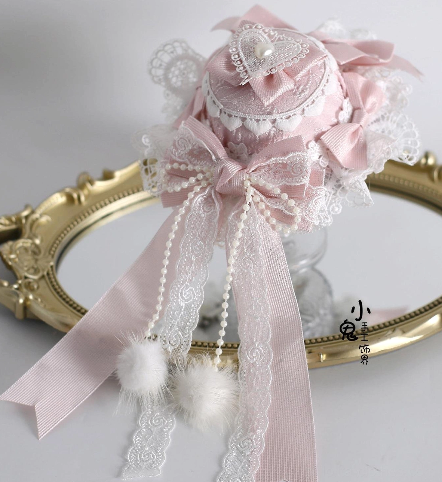 Sweet Lolita cuffs accessory pair with elastic construction, adorned with pom-poms, double-layer lace embroidery, white and pink sweet Lolita aesthetic