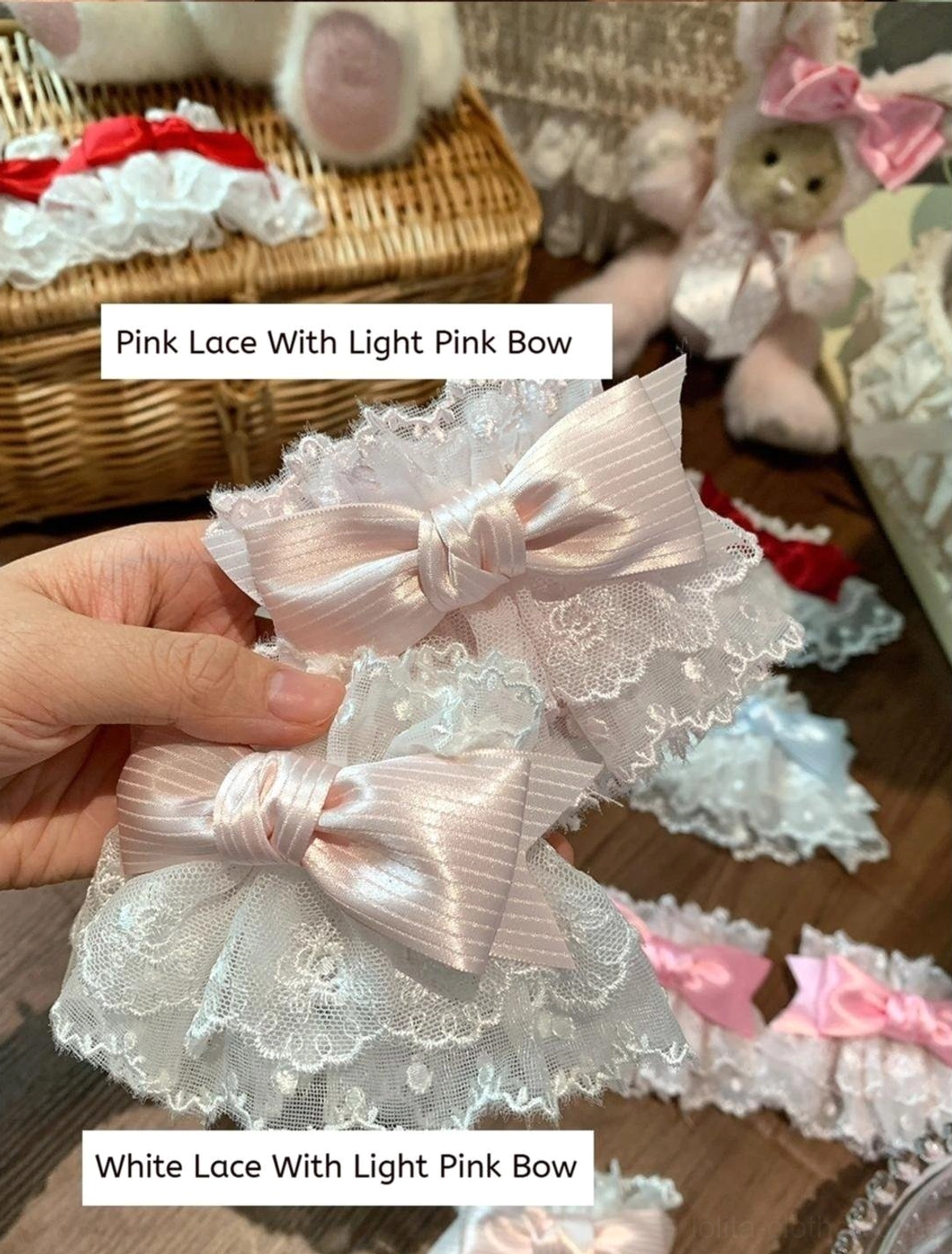 Light pink satin bow Sweet Lolita wrist cuffs on pink and white lace bases paired display