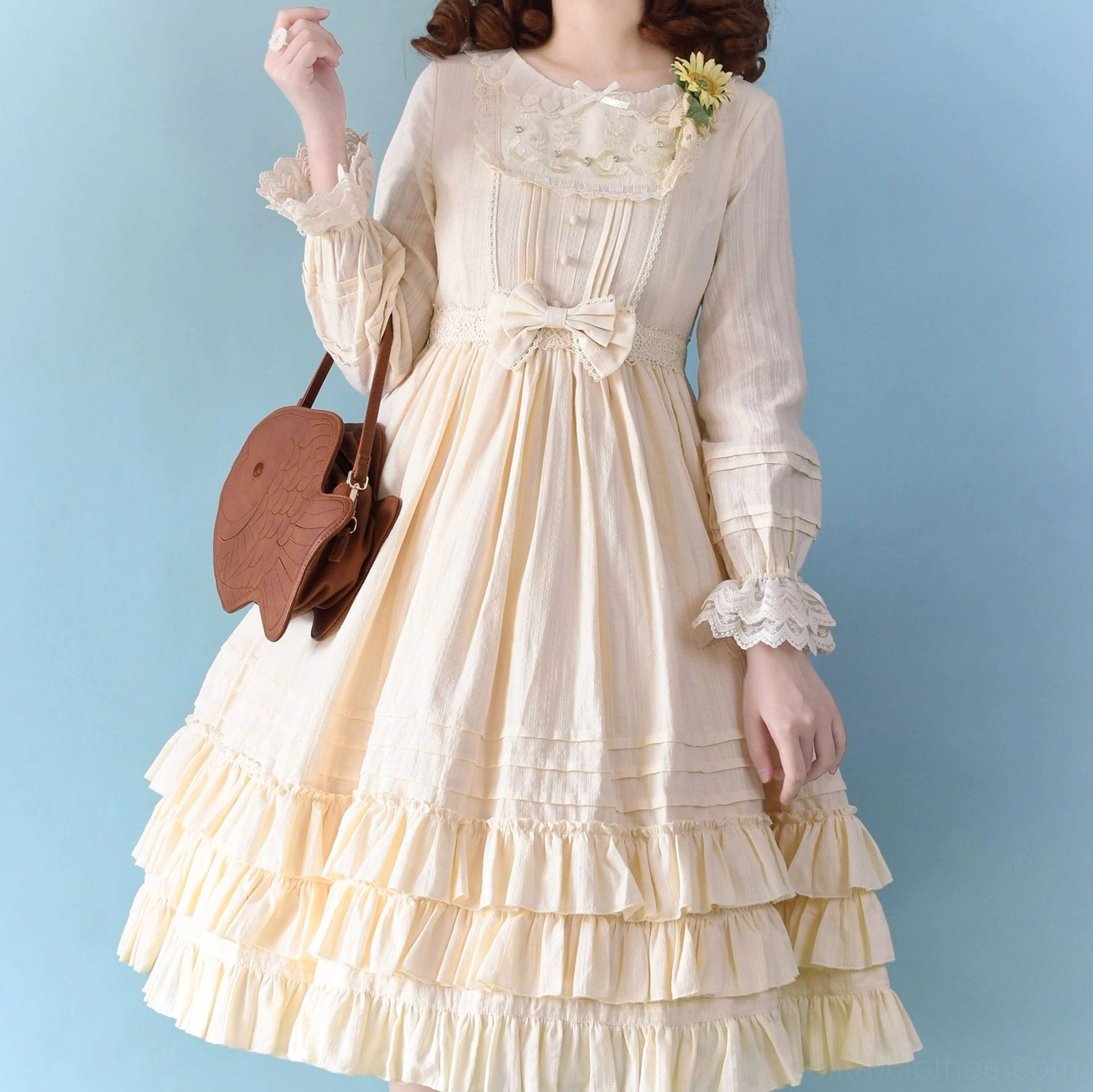 Cream beige Sweet Lolita embroidered OP dress featuring detailed embroidered collar, ruffled tiered skirt, waist bow decoration, and refined elegant aesthetic in neutral tone coordination