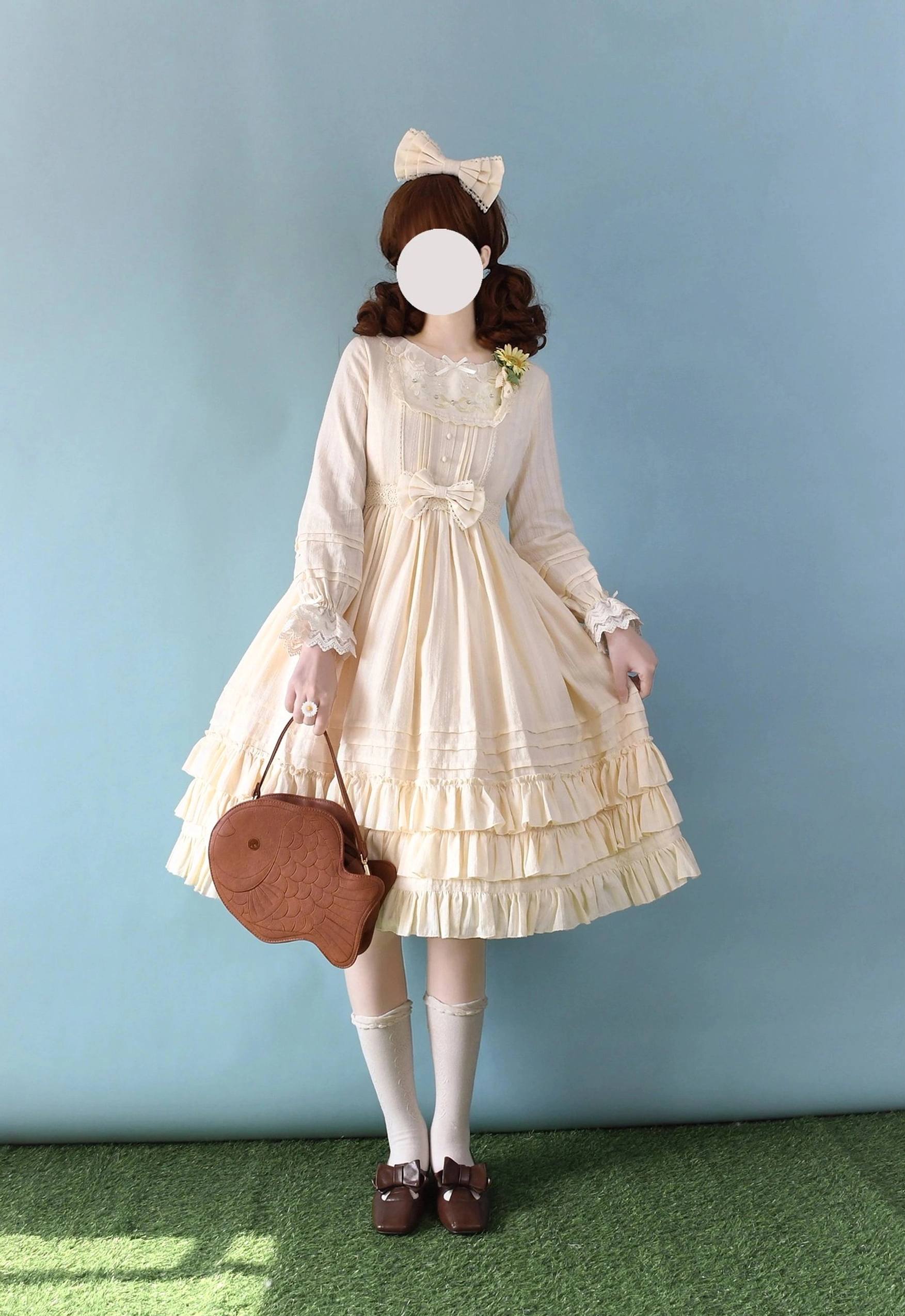 Cream beige Sweet Lolita embroidered OP dress with long sleeves, simple lace neckline, multi-layer ruffled tiered skirt, front waist bow, paired with brown heart-shaped handbag, full-body elegant styling