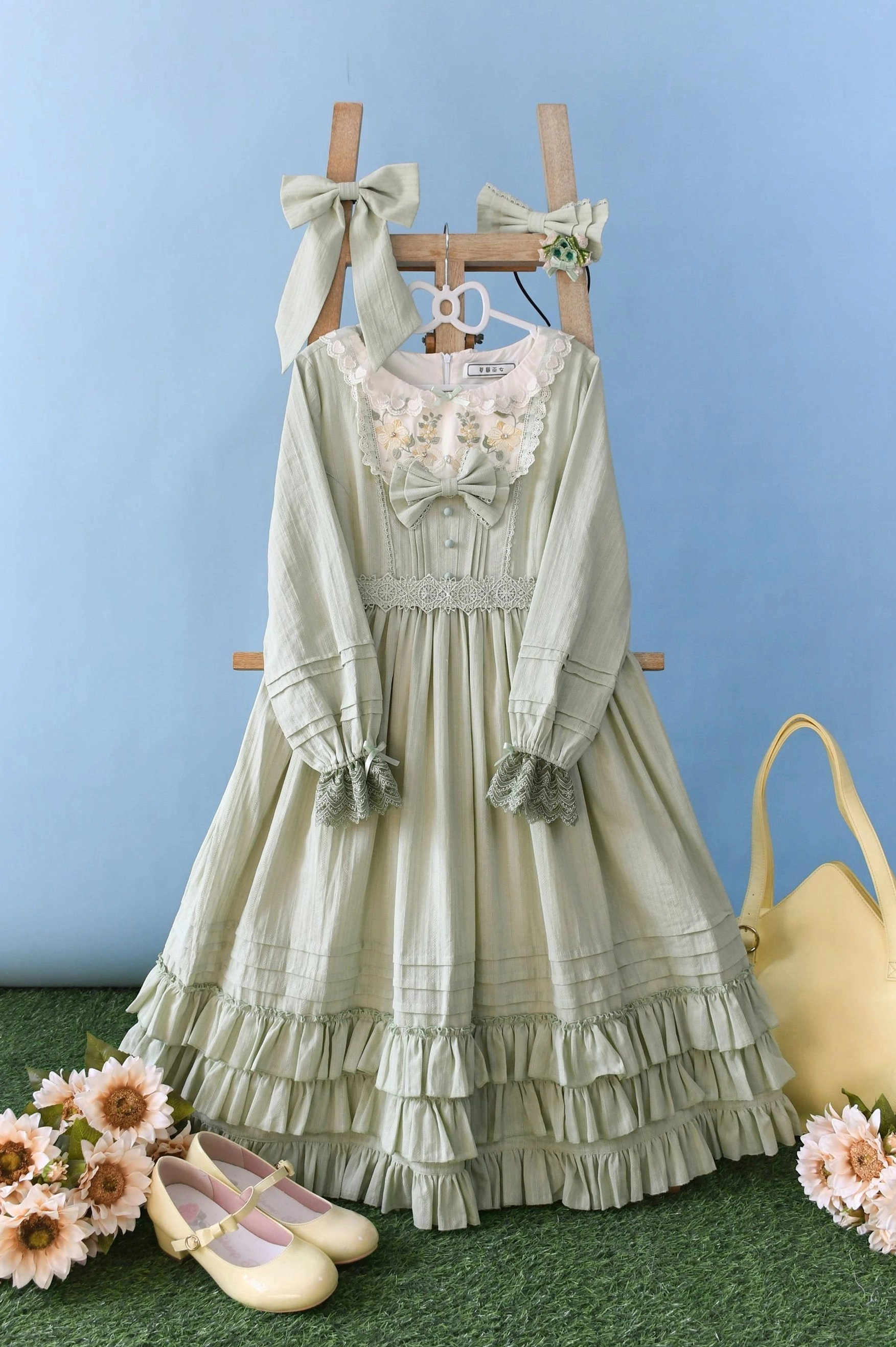 Light green Sweet Lolita embroidered OP dress in short-sleeved and long-sleeved long midi-length variants, featuring embroidered lace neckline, multi-layer ruffled skirt, waist bow, and sage green jacquard fabric