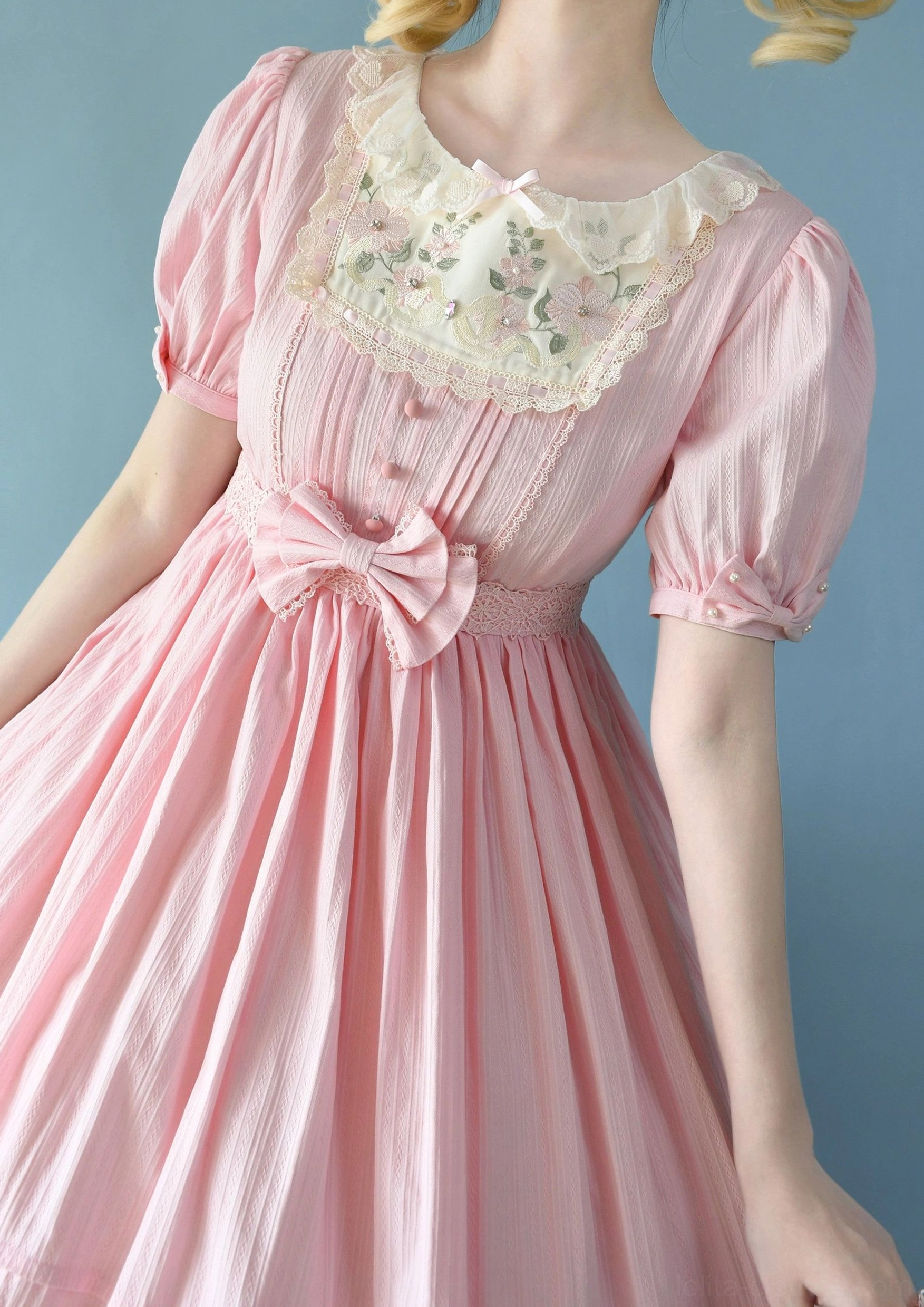 Light purple Sweet Lolita embroidered OP dress long-sleeved short knee-length variant showing puff sleeves, embroidered neckline, ruffled hem, and classic Sweet Lolita design elements