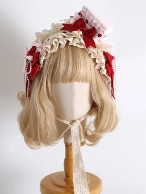 Complete sweet lolita headdress ensemble featuring adjustable headband triangle cake clip and lace choker with red ribbon accents front view