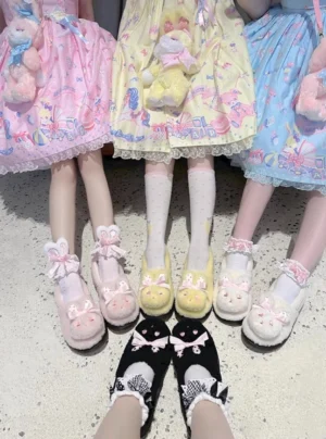 Three models wearing pastel sweet lolita dresses posing together showcasing plush rabbit lolita shoes paired with cute lace-trimmed ankle socks and platform soles in coordinated outfits