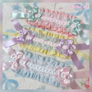 Four assorted sweet Lolita ribbon bow headbands arranged in pastel color sets showcasing different ruffled lace edge designs and satin bow embellishments from top view