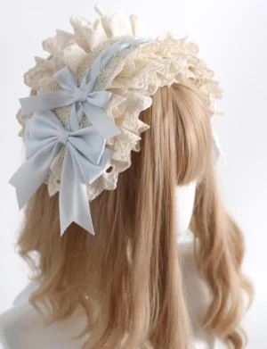 Sweet lolita headdress set featuring cream ruffled lace headband with sky blue double satin bows shown on blonde mannequin wig three-quarter view