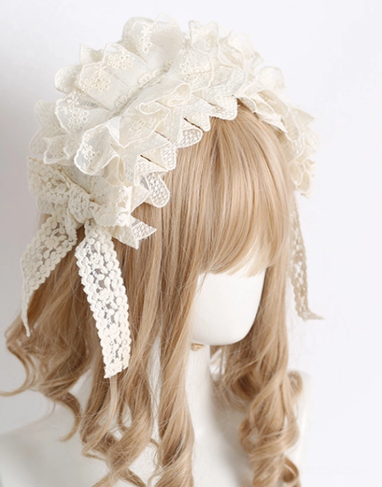Sweet lolita headdress right side three-quarter view showing cream white tone with large ruffled crown, side bow featuring long lace tassels, and floral embossed lace texture detail